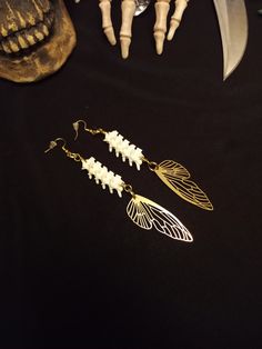 Here is a Nice Pair of Rattlesnake Vertebrae Fairy Wing Bone earrings! Each Pair is Made with 12 Real Rattlesnake Vertebrae, and 2 Gorgeous Gold Fairy Wing Pendants. These Earrings are 6 Inches Long. All Items Ship Within 1-3 Days via USPS First Class Service. Shipping on These Earrings is Free! ( USA Only ) All Bone Jewelry Orders Over 35 USD $ Ship for FREE. International Shipping Will Be 16.00, Australia 18.00 And All Additional Items Add 1.00 to the Shipping Cost. International Shipping May Vertebrae Jewelry, Bone Fairy, Vertebrae Earrings, Real Bone Jewelry, Animal Bone Jewelry, Wiccan Earrings, Oddities Jewelry, Fairy Wing Earrings, Wiccan Necklace