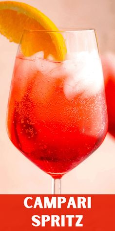 the campari spritz cocktail is garnished with an orange slice