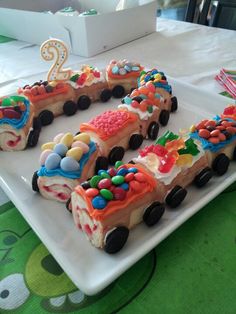 a birthday cake shaped like a train on a plate