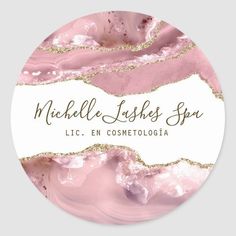 a round sticker with pink marble and gold glitter