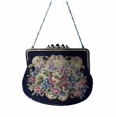 A beautiful Austrian made petite point purse, the tapestry like design depicting pretty flowers on an off white ground with black border. The frame of the purse is painted with black cold enamel in the groove at the front, and engraved on the back, and the clasp is set with the most incredible black glass cabochons with a deep, almost comically dome. There is a barley twist chain handle and the purse is lined with an eau de nil faille. Condition is very good. There are general minor signs of age Vintage Evening Bags With Double Handle, 1930s Handbags, Vintage Compact Evening Bag, Vintage Gold Embroidered Evening Bag, 1930s Purse, Barley Twist, Black Glass, Clutch Handbag, Evening Bags