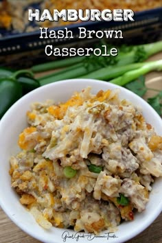 ham brown casserole in a white bowl on a wooden table