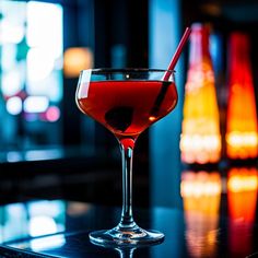 a red drink sitting on top of a table