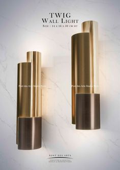 two wall lights are shown in gold and white marble with the words, twigg wall light