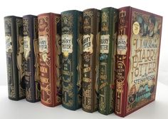 a row of books sitting next to each other on top of a white countertop