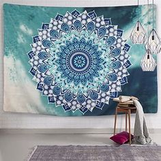 a blue and white tapestry hanging on the wall