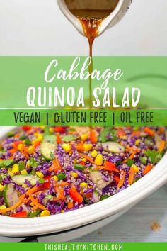 cabbage quinoa salad in a white serving dish with dressing drizzled on top