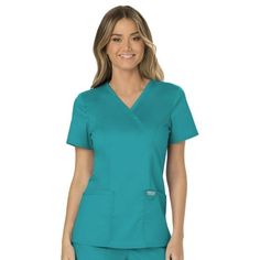 Workwear Revolution | Mock Wrap Nurse Shirt. Join the Workwear Revolution with modern, soft, affordable, and oh-so-comfortable nursing scrubs. Uniform scrubs for women enter a new era of ultra-soft, reliable, durable and easy-care options with Cherokee Workwear Revolution. Soft tri-blend fabric is paired with functional utility details for an updated look and feel you'll love. The two-way stretch poly/rayon/spandex fine twill fabric blend feels soft and smooth to the touch. The breathable and ea Scrubs For Women, Nursing Scrubs, Scrubs Uniform, Womens Scrubs, Scrubs Nursing, Medical Scrubs, Nurse Shirt, Nursing Shirts, Scrub Tops