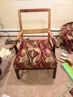 a chair sitting on top of a carpeted floor next to a pile of shoes