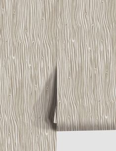 wood grain textured wallpaper in beige and white with a light shadow on it