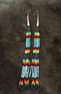 Authentic Beautiful Native American Indian Jewelry Navajo Hand Beaded Long Dangle Earrings. Great for a gift❤️ Handcrafted by Navajo Artist R. Sellers These beautiful earrings are approximately 8" in length and 1" in width. Southwestern Beaded Fringe Dangle Earrings, Southwestern Turquoise Beaded Fringe Earrings, Southwestern Turquoise Earrings With Beaded Fringe, Southwestern Style Beaded Fringe Dangle Earrings, Turquoise Southwestern Earrings With Beaded Fringe, Turquoise Southwestern Beaded Fringe Earrings, Southwestern Adjustable Beaded Fringe Earrings, Southwestern Beaded Fringe Dangle Jewelry, Southwestern Multicolor Nickel-free Beaded Earrings