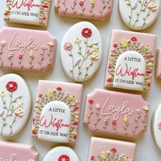 decorated cookies with words and flowers on them