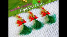 three red and green tassels hanging from a banner