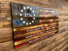 a wooden wall with an american flag painted on it and the words 767 written in white