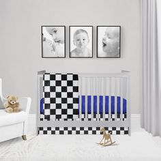 a baby's room with three pictures on the wall and a crib next to it