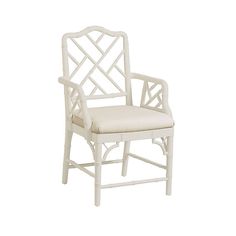 a white chair with an upholstered back and seat cushion on the armrests