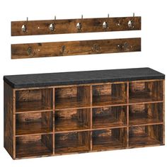 a wooden shelf with several drawers and hooks