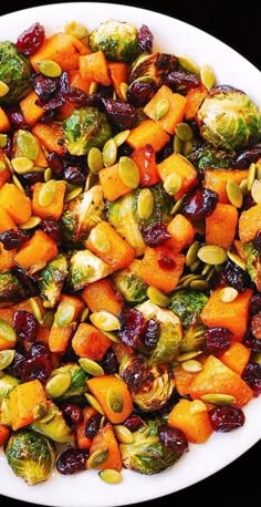 brussel sprouts, brussels sprouts and cranberries in a white bowl