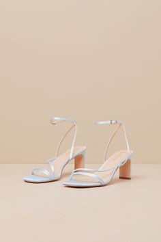 Keep things chic and simple by adding the Lulus Kierha Baby Blue Satin Strappy Low Heel Sandals to any of your effortlessly elegant 'fits! Sleek woven satin shapes these darling heels that feature a square footbed, two slender two straps, and an asymmetrical vamp strap. Matching straps sprout from the sides to cross at the front of the ankle and secure with a gold buckle, all atop a trendy blade heel. 2. 75" wrapped blade heel. Cushioned insole. Felted rubber sole has nonskid markings. Man made Blue Bridal Shoes Low Heel, Dusty Blue Heels Wedding, Strappy Sandals For Spring Prom, Strappy Sandals For Prom In Spring, Blue Sandals For Summer Prom, Blue Sandals For Prom In Summer, Spring Prom Strappy Sandals, Low Heel Satin Sandals For Spring, Strappy Sandals For Spring Wedding