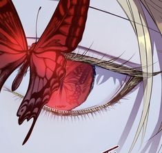 a close up of a butterfly on the side of a person's eye