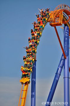 a roller coaster ride with people riding it