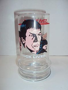 a glass cup with an image of elvis presley on it