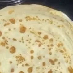 an uncooked tortilla sitting on top of a stove