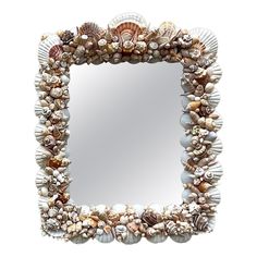 a mirror that has shells on it