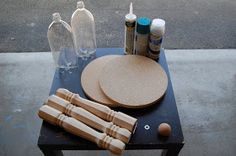 a table topped with different types of items on top of a black table next to a street