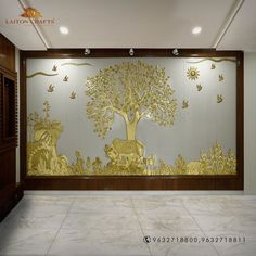 the wall is decorated with golden trees and animals on it's sides, along with white marble flooring