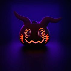 a glowing pumpkin with an evil face on it