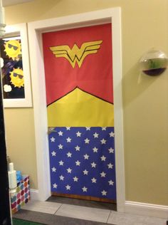 a door decorated to look like wonder woman with stars and stripes on the bottom half