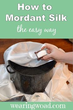 a woman is using a cloth to clean an iron skillet with text overlay that reads how to mordant silk the easy way