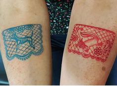 two people with tattoos on their legs, one has a red and the other is blue