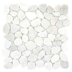 white pebbles are arranged in a pattern on the wall