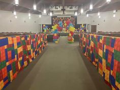 an empty church with colorful decorations on the walls