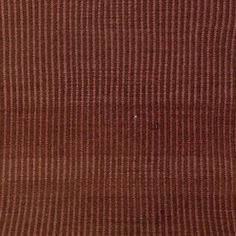 an area rug with red and brown stripes