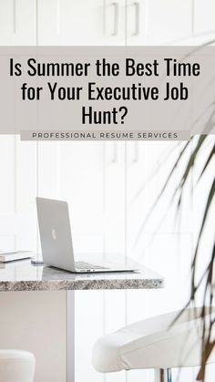 a laptop computer sitting on top of a desk next to a plant and chair with the words is summer the best time for your executive job hunt?