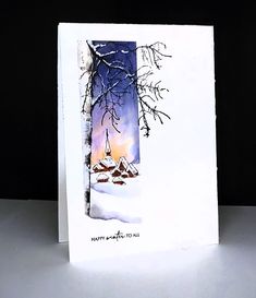 a white card with an image of a snowy scene