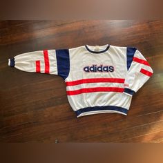 Vintage *Pre-Owned* 1980’s Adidas Crewneck Sweatshirt Always 100% Authentic Estimated Size Is Large Red/White/Blue Multicolored - Color Block Small Spot On Chest Near Neckline - Circled/Highlighted In Photos Truly Amazing Condish For Its Age Approx Measurements Taken Laid Flat Pit To Pit: 25” Shoulder To Hem: 26” Waistline: 18” Sleeves: 27” Will Ship Securely Packed/Tracked Negotiable - Obo Trusted/Reliable Seller Hit Me Up With Any Questions/Offers Adicolor 70s, Adidas Crewneck, Red Adidas, Red White Blue, Adidas Men, White Blue, Crewneck Sweatshirt, Color Block, Red And Blue