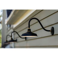 an outdoor light on the side of a house