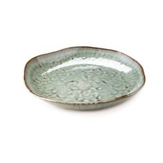 a white and green bowl sitting on top of a table