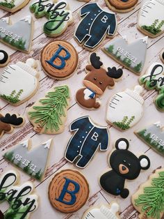 decorated cookies are arranged on a table with the names of their favorite people and animals