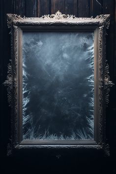 an old frame with frost on it in front of a wooden wall