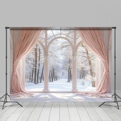 an open window with pink curtains in front of snow covered trees and white flooring