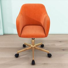 an orange office chair sitting on top of a wooden floor