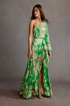 Be on the best-dressed list at your next event wearing our Caprice Maxi Dress. This vibrant style designed from printed charmeuse features a one shoulder design complimented by a voluminous long sleeve, self-tie waist band and a floor-length gathered skirt. European Wedding Guest Dress, Garden Cocktail Attire Wedding, Bohemian Dress Code, Garden Party Dress Code, Bohemian Dress Formal, Dress Code For Women, Atelier Dress, Black Tie Wedding Guest Dress, Party Dress Codes