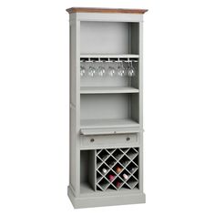 a tall white shelf with wine glasses on top and bottles in the bottom drawer,