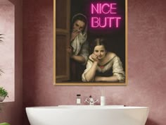 a bathroom with pink walls and a white bathtub in front of a painting on the wall