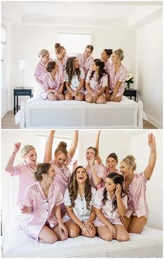 a group of women in pink pajamas sitting on top of a white bed and posing for the camera